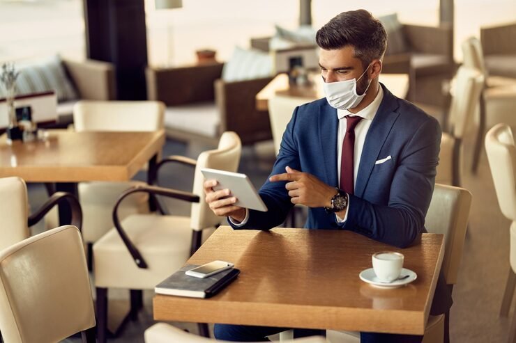 businessman with protective face mask using touchpad cafe 637285 8913
